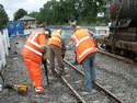 Hand tamping the new half panel. (Photo: D.Firth)