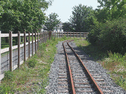 Looking South as the line passes behind the Wilkinson's stores (Photo: L.Armstrong)