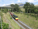 The Vale of Ffestiniog and Caernarfon Castle heading for Beddgelert at Pont Cae'r Gors. (Photo: Peter Balderston)