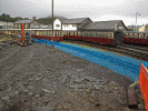 Exploratory work ahead of the Cob Widening project starting in January 2012 involved building an access ramp to the foreshore at Porthmadog Harbour Station. Pic: Andrew Thomas