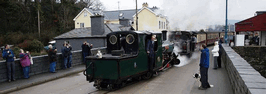 Blanche & Merddin Emrys leaving Porthmadog with the first public train to Caernarfon. (Photo: Andrew Thomas/FR)