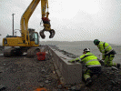 Laying the final blocks for the wave wal - Andrew Thomas