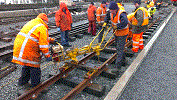 Tightening track bolts into plastic sleepers using a Geismar petrol impact wrench on 1 road. 17-2-14. Simon Banbury