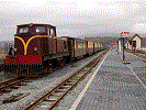 Welsh Highland stock on an ECS move waits in the WHR loop behind Castell Caernarfon - Pic: F&WHR